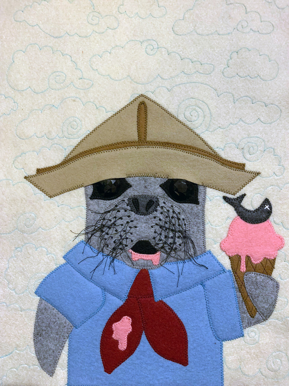 felt portrait of a seal with an ice cream cone